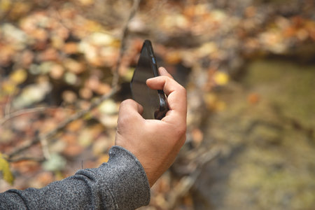 Man taking nature by smartphone. Hobby. Travelの写真素材
