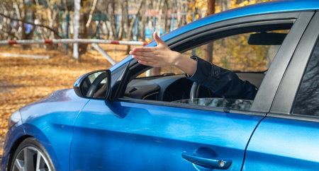 Angry female hand with a car.の写真素材