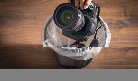 Professional dslr camera and trash can.の写真素材