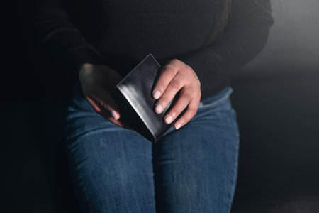 Young woman showing wallet. fashionの写真素材