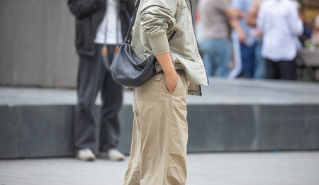 Woman with a bag in the city street.の写真素材