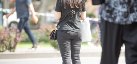 Woman in a bag in the city street.の写真素材