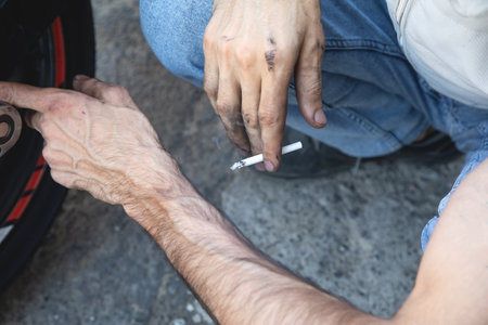Caucasian man smoking a cigarette.の写真素材