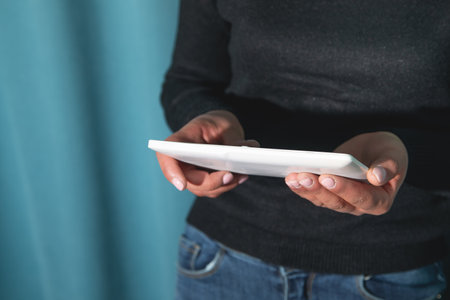 Caucasian young woman using tablet.の写真素材