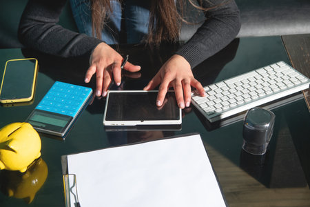Caucasian young woman using tablet.の写真素材