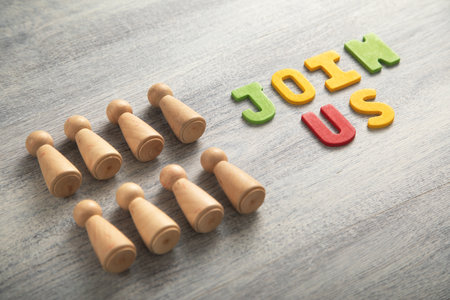 Join Us word with a wooden human figures.の写真素材
