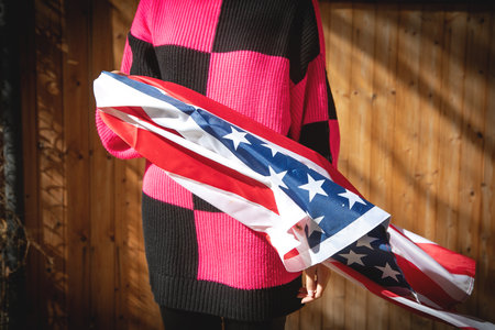 Caucasian young woman with a Us flag.の写真素材