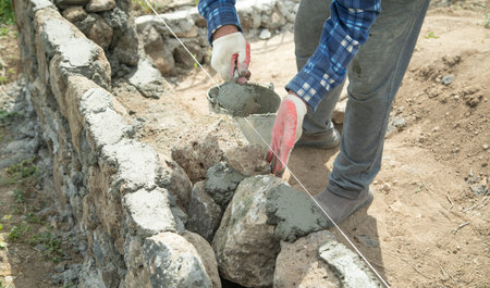 Craftsman working in rough stones in outdoor.の写真素材