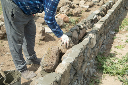 Craftsman working in rough stones in outdoor.の写真素材