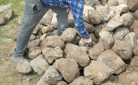 Craftsman working in rough stones in outdoor.の写真素材