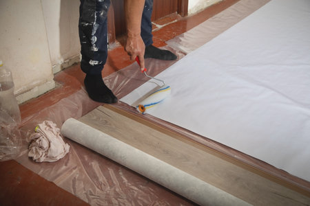 Caucasian worker prepare wallpaper in house renovation.の写真素材