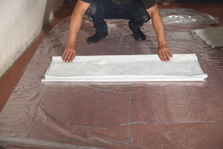 Worker prepare wallpaper in house renovation.の写真素材