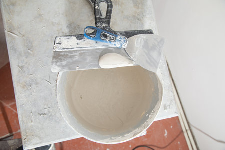 Bucket with a spatula for leveling.の写真素材