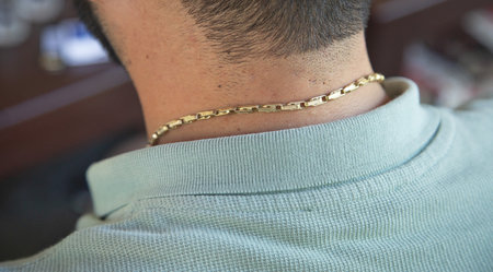 Caucasian man with a golden necklace.の写真素材