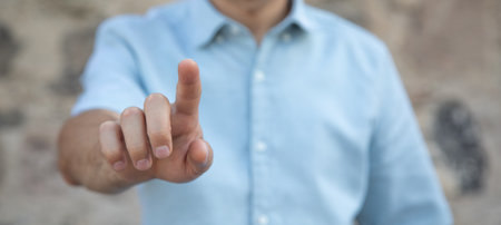 Human hand touching in empty screen.