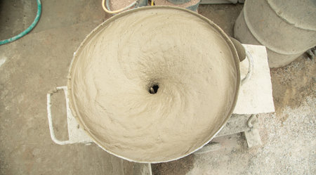 Concrete with cement mixer machine at construction site.