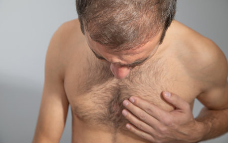 Caucasian man suffering from heart ache.