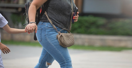 Woman in a bag in the city street.の写真素材