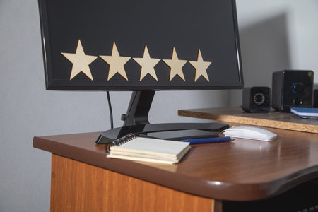 Wooden 5 stars on the workplace. Customer satisfaction