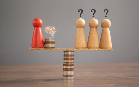 Wooden human figure, coins on the table.
