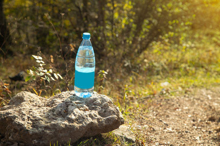 Bottle of clean water in nature.の写真素材