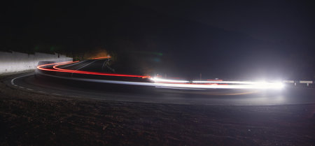 Highway car light trails at night.の写真素材