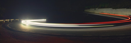 Highway car light trails at night.の写真素材