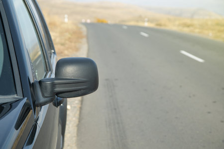 Car driving on the road. Car mirrorの写真素材