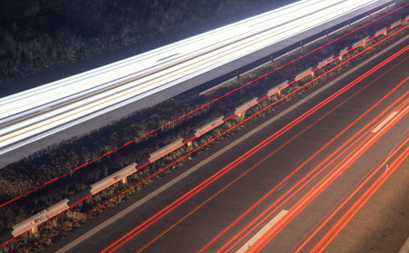 Highway car light trails at night.
