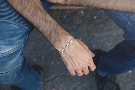 Male hand with an expensive bracelet. Fashion accessories and jewelry