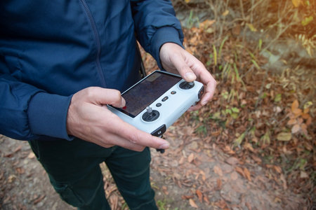Caucasian man using drone controller.
