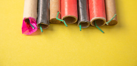 Firecrackers on the yellow background.