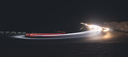 Highway car light trails at night.の写真素材