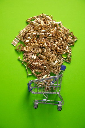Shopping cart with a golden jewellery.の写真素材