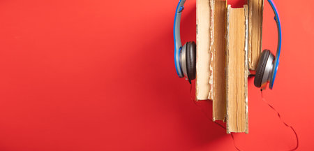 Blue headphones and book. Hobby. Musicの写真素材