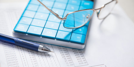 Financial accounting with a calculator and pen. Financeの写真素材