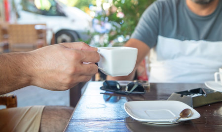 Coffee on the table in outdoor cafe.の写真素材