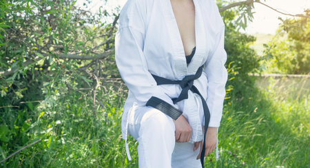 Caucasian woman in karate uniform at outdoor.の写真素材