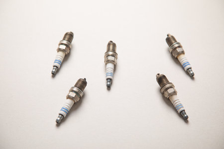 Car spark plugs on the gray background.の写真素材