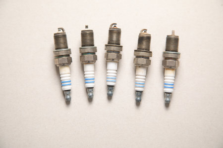 Car spark plugs on the gray background.の写真素材