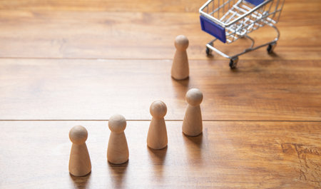 Shopping cart with a wooden human figures.