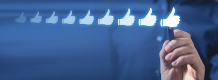Growing thumbs up symbols. Social media. Likeの写真素材