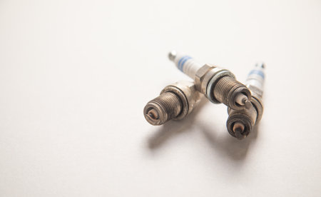 Car spark plugs on the gray background.の写真素材