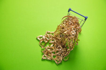 Shopping cart with a golden jewellery.の写真素材