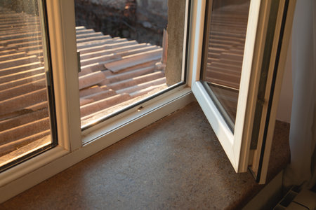 White opened plastic pvc window at home.の写真素材