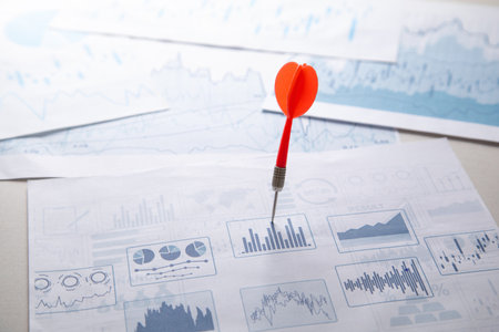 Dart arrow on financial graph. Businessの写真素材