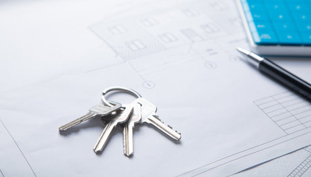 House keys on architectural project plan.の写真素材