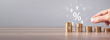 A percentage sign with a growing arrows and coins.の写真素材