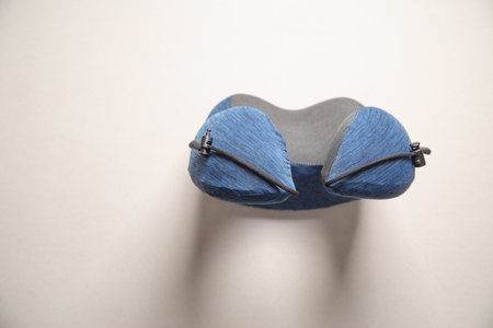 Neck pillow on gray background. Comfort and relaxationの写真素材