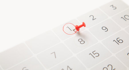 Push pin on a calendar. planning. Businessの写真素材
